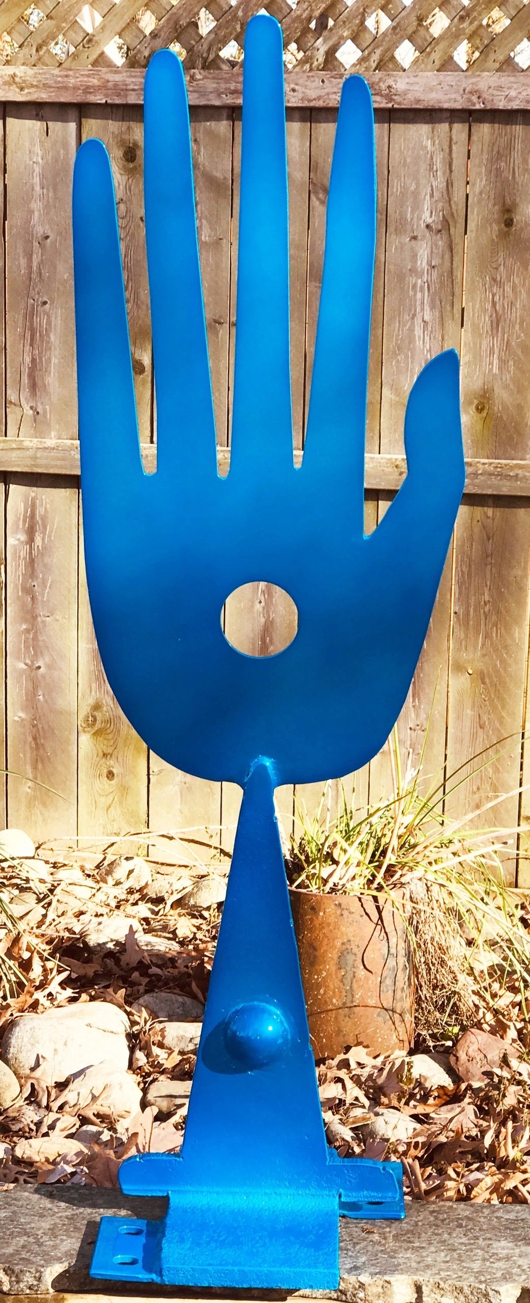 Hand with Dot, metal sculpture by Brian Kirk