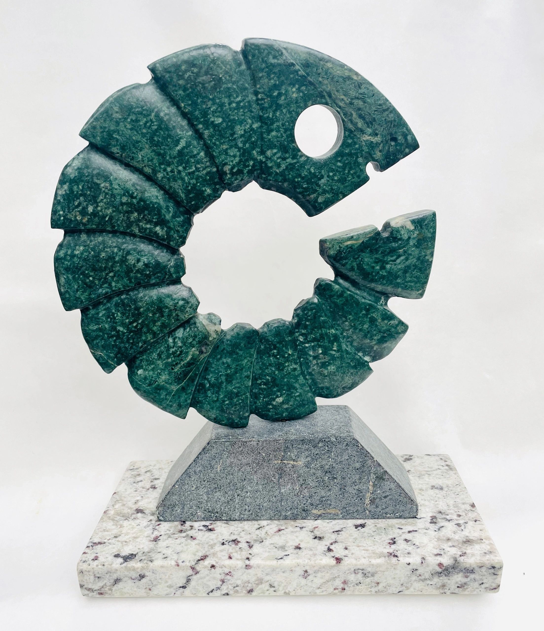 Ouroboros, stone carving by Brian Kirk